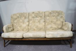 An Ercol three seater sofa, with patterned cushioned seats,