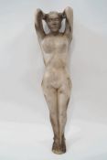 A Studio pottery figure of an outstretched female nude, impressed monogram 'ET' and numbered 712,