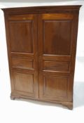 A mahogany panelled double wardrobe,