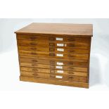 An oak two part plan chest with eight drawers on plinth base,