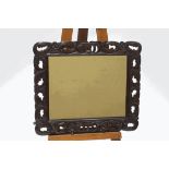 A Jacobean style stained oak framed wall mirror,