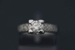 A diamond ring, the white mount stamped '750', the brilliant cut of approximately 0.