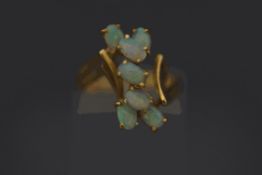 A seven stone opal cluster ring, unmarked, finger size J, 3.