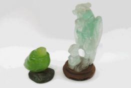 A Chinese carved jade figure of a bird, upon a turned wooden stand, 18cm high,