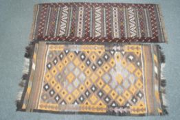 An Eastern flat weave rug, with geometric diamond design to central field, 176cm x 94cm,