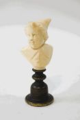 A 19th century Ivory carved figure of a boy with bronze patinated base,