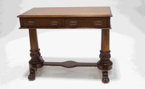 A late 19th Century mahogany two drawer writing table,
