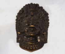 An Indian bronze mask, depicting the God Ganesh,