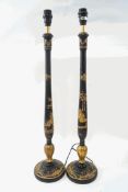 A pair of Chionisere style table lamps, decorated with chinoisere scenes on a black ground,