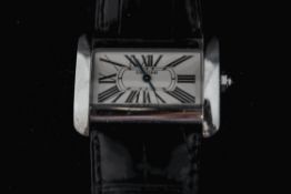 Cartier, a lady's small tank Divan steel wristwatch, on a strap, facetted stone set crown,