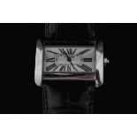 Cartier, a lady's small tank Divan steel wristwatch, on a strap, facetted stone set crown,