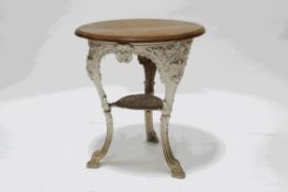 A Victorian painted cast iron pub table, with later wooden top,