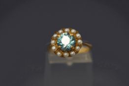 A 9 carat gold blue zircon and cultured pearl cluster ring, finger size M, 3.