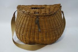 A vintage wicker fishing creel, with later canvas and leather strap, 35.5cm high x 48.