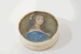 An 18th century ivory circular box, with inset portrait of a lady wearing a blue dress,