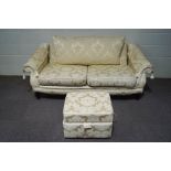 A modern cream three seater settee,