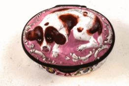 A 19th century enamel snuff box, the top with a recumbent spaniel on a pink ground,