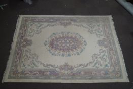 An Indian Aubussan woolwork carpet, a central floral medallion over a cream ground,