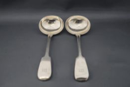 A pair of William IV silver sauce ladles, partial maker's mark, London 1836, fiddle pattern,