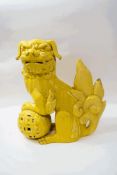 An early 20th century Chinese earthenware Dog of Fo with unusual yellow glaze,