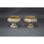 A pair of late George IV silver salts, Clement Cheese, London 1829, later embossed with fruit,