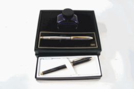 A Cross fountain pen and ink set, silver and gold tone body, boxed,