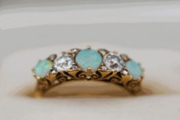An opal and diamond five stone ring, stamped '18ct',