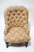 A Victorian mahogany button back nursing chair, with patterned fabric,