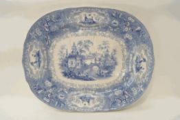 A 19th century earthenware blue and white meat dish, with drainer well,