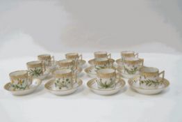 A set of twelve Royal Copenhagen Flora Danica coffee cups and saucers,