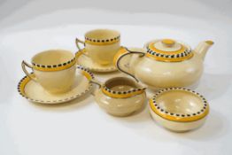 A Grays Pottery Susie Cooper tete-a-tete service, hand painted yellow banding with black detail,