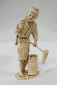 An early 20th century Japanese carved ivory figure of a craftsman, disassembled, signature to base,