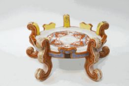 A Chinese porcelain jardiniere stand, decorated in orange,