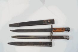 A WWII German bayonet, stamped Simpson & Co Suhl, and an Enfield MK4 bayonet,