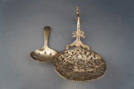 A pierced Dutch white metal spoon with engraved inscription,