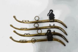 Two pairs of brass horse harnesses,