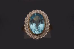 A 9 carat gold blue topaz and diamond cluster ring, finger size P, 4.