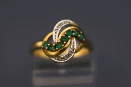A diamond and emerald 9 carat gold dress ring, of cross over style, finger size N, 3.