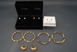 A collection of three pairs of 9 carat gold hoop earrings and three pairs of ear studs; 6.