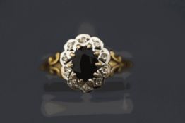 A 9 carat gold sapphire and single cut diamond set cluster ring, finger size P, 2.