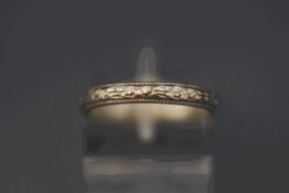 A patterned wedding ring, stamped 'Plat', finger size O, 3.