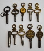 Ten assorted pocket watch keys, one advertising Ealing,