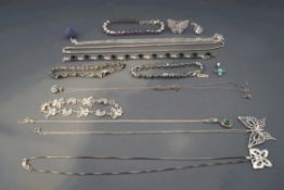 A collection of silver and silver coloured necklaces,
