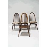 A set of four Ercol stick back kitchen chairs and an oak drawleaf refectory style dining table,