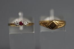 A 9 carat three stone ruby and cubic zirconia ring,