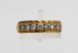 A 9 carat gold seven stone cubic zirconia half hoop ring, finger size O 1/2, 2.