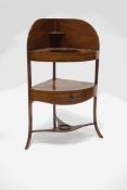 A George III mahogany bow fronted corner wash stand,