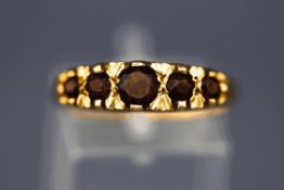 A 9 carat gold five stone garnet ring, finger size P 1/2, 3.