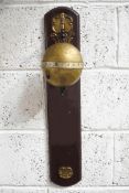 A Thwaites & Reed falling ball clock, No 338/500, on wooden and brass mounted plaque,