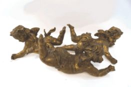 Three gilded composite hanging cherubs, approximately 45cm long,